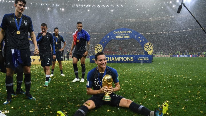 France’s forward Florian Thauvin holds the World Cup trophy (FRANCK FIFE/AFP via Getty Images)