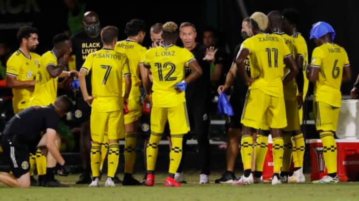 REUNION, FLORIDA – JULY 21: Head coach Caleb Porter of the Columbus Crew talks with his team during a water break against Atlanta United during a Group E match as part of the MLS Is Back Tournament at ESPN Wide World of Sports Complex on July 21, 2020 in Reunion, Florida. (Photo by Michael Reaves/Getty Images)