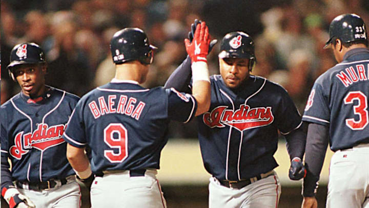 Cleveland Indians Albert Belle (2nd R) is greeted by teammates Carlos Baerga (2nd L), Kenny Lofton (L) and Eddie Murray (R) after Belle hit a three-run homerun off Oakland Athletics starting pitcher Carlos Reyes 08 May in Oakland, California. The Indians defeated the A’s, 7-3.AFP PHOTOS/John G. MABANGLO AFP/jgm (Photo by JOHN G. MABANGLO / AFP) (Photo credit should read JOHN G. MABANGLO/AFP via Getty Images)