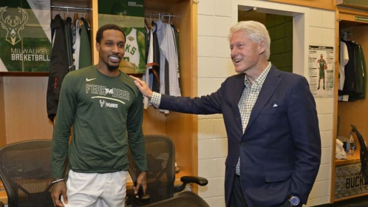 Milwaukee, WI - APRIL 26: Brandon Jennings #11 of the Milwaukee Bucks poses for a photo with former President of the United States of America Bill Clinton prior to Game Six of Round One of the 2018 NBA Playoffs against the Boston Celtics on April 26, 2018 at the BMO Harris Bradley Center in Milwaukee, Wisconsin. NOTE TO USER: User expressly acknowledges and agrees that, by downloading and or using this Photograph, user is consenting to the terms and conditions of the Getty Images License Agreement. Mandatory Copyright Notice: Copyright 2018 NBAE (Photo by David Dow/NBAE via Getty Images)