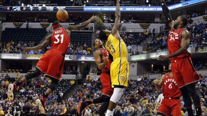Dec 14, 2015; Indianapolis, IN, USA; Indiana Pacers forward Paul George (13) has the ball stripped away by Toronto Raptors forward Terrence Ross (31) at Bankers Life Fieldhouse. Indiana defeats Toronto 106-90. Mandatory Credit: Brian Spurlock-USA TODAY Sports