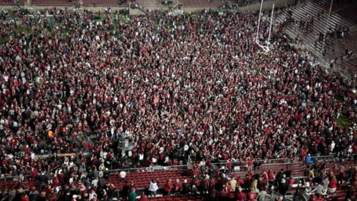Nov 7, 2013; Stanford, CA, USA; Stanford Cardinal fans rush the field after the win against the Oregon Ducks at Stanford Stadium. The Stanford Cardinal defeated the Oregon Ducks 26-20. Mandatory Credit: Kelley L Cox-USA TODAY Sports