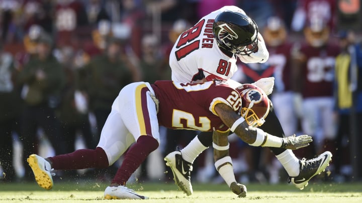 LANDOVER, MD – NOVEMBER 04: Tight end Austin Hooper #81 of the Atlanta Falcons is tackled by free safety Ha Ha Clinton-Dix #20 of the Washington Redskins in the second quarter at FedExField on November 4, 2018 in Landover, Maryland. (Photo by Patrick McDermott/Getty Images)