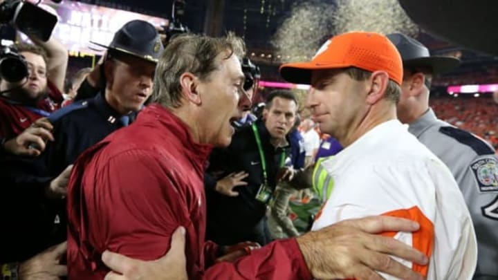 Jan 11, 2016; Glendale, AZ, USA; Clemson Tigers head coach Dabo Swinney congratulates Alabama Crimson Tide head coach Nick Saban following the 45-40 victory in the 2016 CFP National Championship at University of Phoenix Stadium. Mandatory Credit: Matthew Emmons-USA TODAY Sports