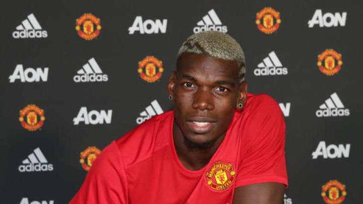 MANCHESTER, ENGLAND - AUGUST 08: (EXCLUSIVE COVERAGE) Paul Pogba of Manchester United poses after signing for the club at Aon Training Complex on August 8, 2016 in Manchester, England. (Photo by John Peters/Man Utd via Getty Images)