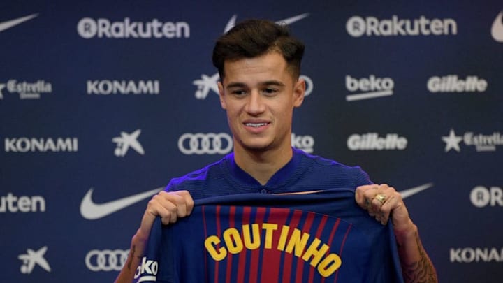 BARCELONA, SPAIN - JANUARY 08: New Barcelona signing Philippe Coutinho poses for a photograph with his new shirt as he is unveiled at Camp Nou on January 8, 2018 in Barcelona, Spain. The Brazilian player signed from Liverpool, has agreed a deal with the Catalan club until 2023 season. (Photo by David Ramos/Getty Images)
