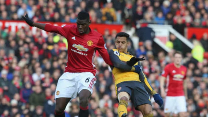 MANCHESTER, ENGLAND – NOVEMBER 19: Paul Pogba of Manchester United in action with Alexis Sanchez of Arsenal during the Premier League match between Manchester United and Arsenal at Old Trafford on November 19, 2016 in Manchester, England. (Photo by Tom Purslow/Man Utd via Getty Images)