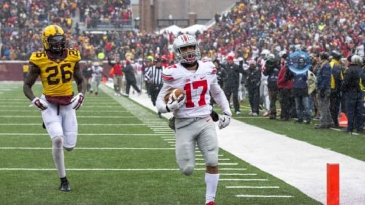 Nov 15, 2014; Minneapolis, MN, USA; Ohio State Buckeyes running back Jalin Marshall (17) rushes for a touchdown in the first half against the Minnesota Golden Gophers at TCF Bank Stadium. Mandatory Credit: Jesse Johnson-USA TODAY Sports