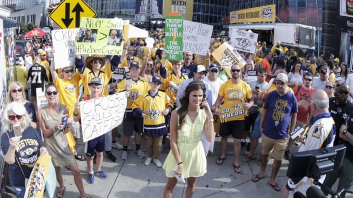 NASHVILLE, TN - JUNE 11: Predator fans hold signs in preparation for television interview prior to game 6 of the 2017 NHL Stanley Cup Finals between the Pittsburgh Penguins and Nashville Predators on June 11, 2017, at Bridgestone Arena in Nashville, TN. (Photo by John Crouch/Icon Sportswire via Getty Images)