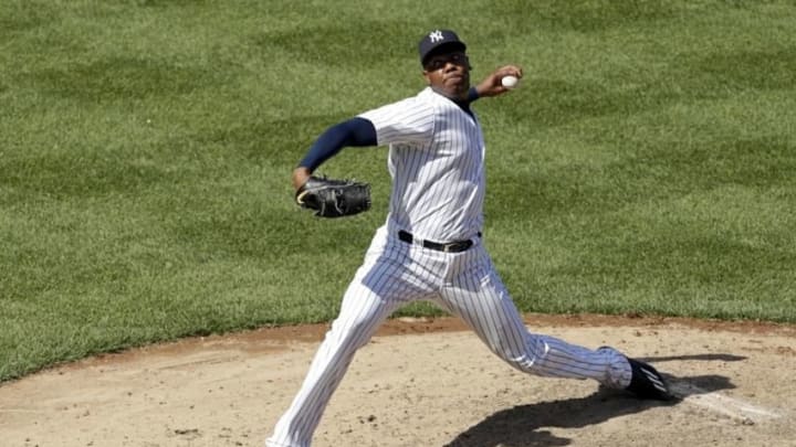 Jun 30, 2016; Bronx, NY, USA; New York Yankees relief pitcher Aroldis Chapman (54) pitches against the Texas Rangers during the ninth inning at Yankee Stadium. Yankees won 2-1. Mandatory Credit: Adam Hunger-USA TODAY Sports