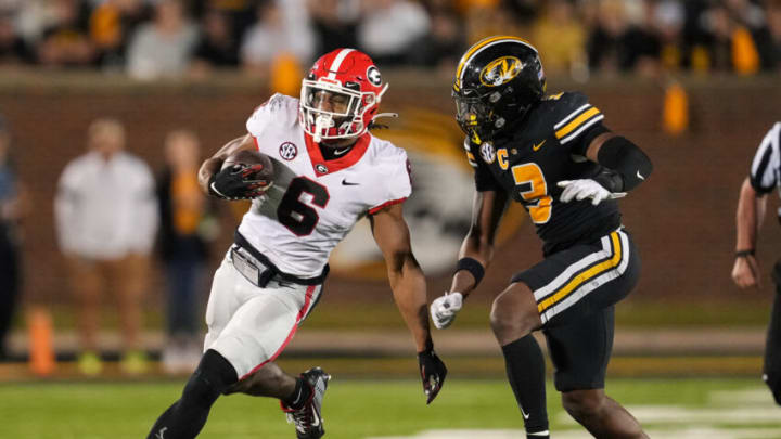 COLUMBIA, MO - OCTOBER 01: Kenny McIntosh #6 of the Georgia Bulldogs runs the ball against Martez Manuel #3 of the Missouri Tigers during the second half at Faurot Field/Memorial Stadium on October 1, 2022 in Columbia, Missouri. Georgia defeated Missouri 26-22. (Photo by Jay Biggerstaff/Getty Images)