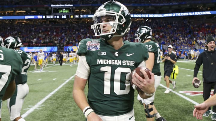 Dec 30, 2021; Atlanta, GA, USA; Michigan State Spartans quarterback Payton Thorne (10) celebrates after a victory against the Pittsburgh Panthers in the second half during the 2021 Peach Bowl at Mercedes-Benz Stadium. Mandatory Credit: Brett Davis-USA TODAY Sports