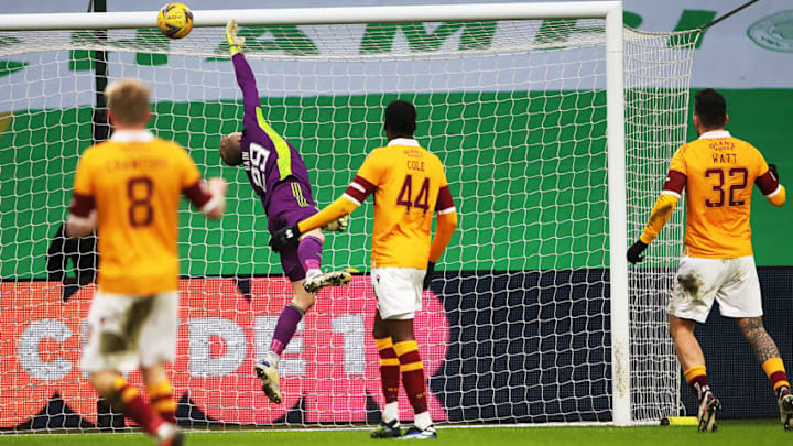 GLASGOW, SCOTLAND - FEBRUARY 06: Scott Bain of Celtic is beaten by the shot of Allan Campbell (un seen) during the Ladbrokes Scottish Premiership match between Celtic and Motherwell at Celtic Park on February 06, 2021 in Glasgow, Scotland. Sporting stadiums around the UK remain under strict restrictions due to the Coronavirus Pandemic as Government social distancing laws prohibit fans inside venues resulting in games being played behind closed doors. (Photo by Ian MacNicol/Getty Images)