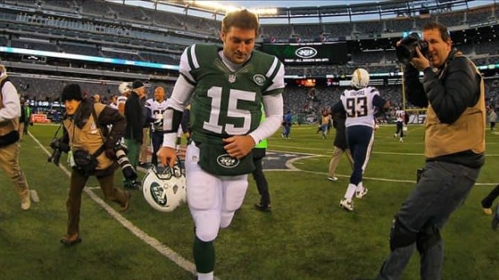 Dec 23, 2012; East Rutherford, NJ, USA; New York Jets quarterback Tim Tebow (15) runs off the field after the Jets 27-17 loss to the San Diego Chargers at MetLIfe Stadium. The Chargers defeated the Jets 27-17. Mandatory Credit: Ed Mulholland-USA TODAY Sports