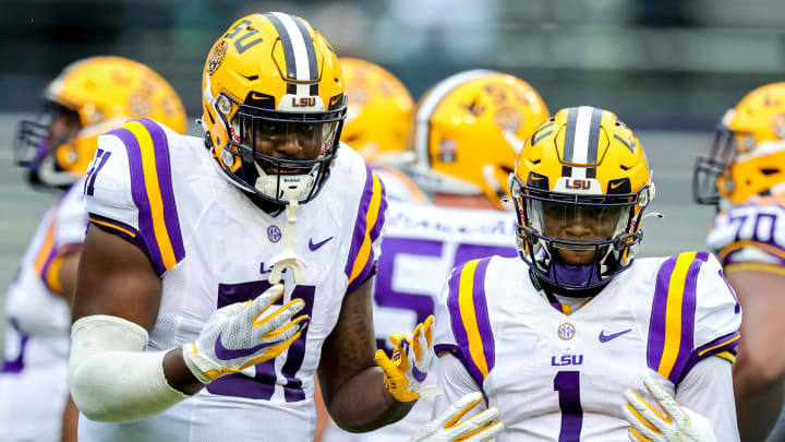 Apr 17, 2021; Baton Rouge, Louisiana, USA; LSU Tigers offensive tackle Dare Rosenthal (51) and LSU Tigers wide receiver Kayshon Boutte (1) pose for the camera on a time out during the first half of the annual Purple and White spring game at Tiger Stadium. Mandatory Credit: Stephen Lew-USA TODAY Sports