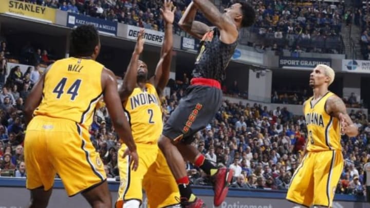 Dec 28, 2015; Indianapolis, IN, USA; Atlanta Hawks guard Jeff Teague (0) takes a shot against Indiana Pacers guard Rodney Stuckey (2) at Bankers Life Fieldhouse. Mandatory Credit: Brian Spurlock-USA TODAY Sports