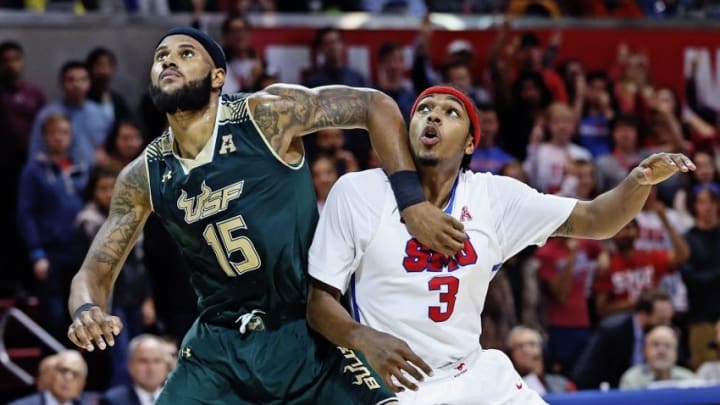 Jan 2, 2016; Dallas, TX, USA; Southern Methodist Mustangs guard Sterling Brown (3) and South Florida Bulls center Jaleel Cousins (15) battle for position during the second half at Moody Coliseum. Mandatory Credit: Kevin Jairaj-USA TODAY Sports