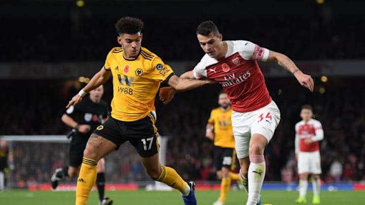 LONDON, ENGLAND - NOVEMBER 11: Granit Xhaka of Arsenal battles for possession with Morgan Gibbs-White of Wolverhampton Wanderers during the Premier League match between Arsenal FC and Wolverhampton Wanderers at Emirates Stadium on November 11, 2018 in London, United Kingdom. (Photo by Shaun Botterill/Getty Images)