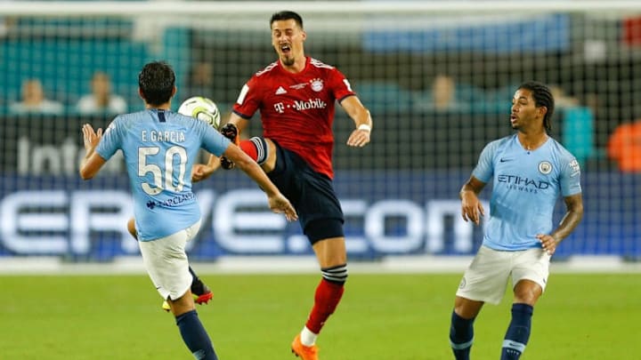 MIAMI, FL - JULY 28: Sandro Wagner #2 of Bayern Munich battles for a the ball with Douglas Luiz #39 and Eric Garcia #50 of Manchester City in the second half of the International Champions Cup at Hard Rock Stadium on July 28, 2018 in Miami, Florida. (Photo by Michael Reaves/Getty Images)