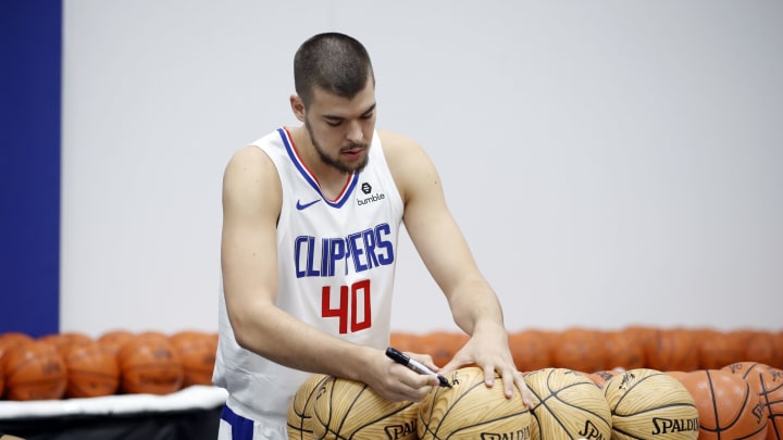 PLAYA VISTA, CALIFORNIA – SEPTEMBER 29: Ivica Zubac #40 of the LA Clippers autographs balls during the LA Clippers media day at Honey Training Center on September 29, 2019, in Playa Vista, California. (Photo by Josh Lefkowitz/Getty Images)