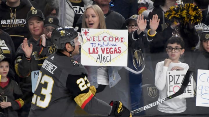 LAS VEGAS, NEVADA - FEBRUARY 20: Alec Martinez #23 of the Vegas Golden Knights skates past a fan holding a sign welcoming him to the team as he warms up before a game against the Tampa Bay Lightning at T-Mobile Arena on February 20, 2020 in Las Vegas, Nevada. (Photo by Ethan Miller/Getty Images)