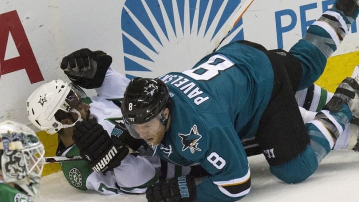 Mar 26, 2016; San Jose, CA, USA; San Jose Sharks center Joe Pavelski (8) blocks Dallas Stars defenseman Johnny Oduya (47) into the ice behind the net in the second period at SAP Center at San Jose. Mandatory Credit: Kenny Karst-USA TODAY Sports