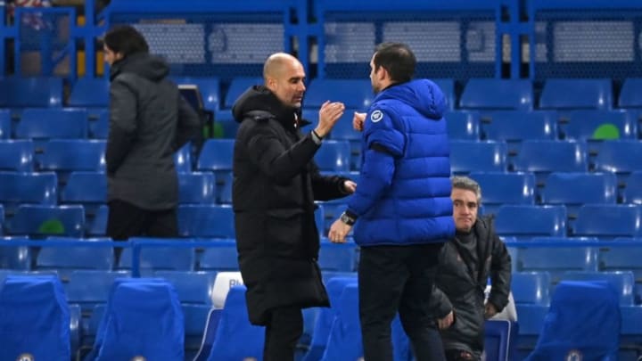 Chelsea's English head coach Frank Lampard (R) shakes hands with Manchester City's Spanish manager Pep Guardiola (L) at the end of the match during the English Premier League football match between Chelsea and Manchester City at Stamford Bridge in London on January 3, 2021. - Manchester City won the game 3-1. (Photo by Shaun Botterill / POOL / AFP) / RESTRICTED TO EDITORIAL USE. No use with unauthorized audio, video, data, fixture lists, club/league logos or 'live' services. Online in-match use limited to 120 images. An additional 40 images may be used in extra time. No video emulation. Social media in-match use limited to 120 images. An additional 40 images may be used in extra time. No use in betting publications, games or single club/league/player publications. / (Photo by SHAUN BOTTERILL/POOL/AFP via Getty Images)