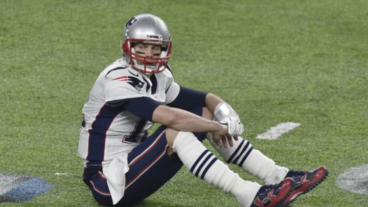 MINNEAPOLIS, MN - FEBRUARY 04: Tom Brady #12 of the New England Patriots sits on the field an looks on after a play against the Philadelphia Eagles during Super Bowl LII at U.S. Bank Stadium on February 4, 2018 in Minneapolis, Minnesota. The Eagles defeated the Patriots 41-33. (Photo by Focus on Sport/Getty Images) *** Local Caption *** Tom Brady