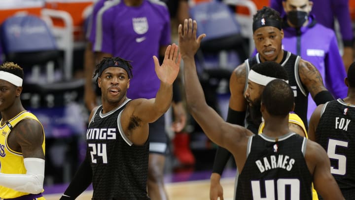 Denver Nuggets offseason plans: Buddy Hield congratulates Harrison Barnes of the Sacramento Kings during a timeout against the Los Angeles Lakers at Golden 1 Center.(Photo by Ezra Shaw/Getty Images)