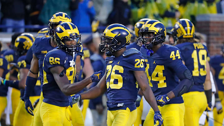 ANN ARBOR, MI – OCTOBER 01: Jehu Chesson #86 of the Michigan Wolverines congratulates teammate Jourdan Lewis #26 for a game ending interception in the fourth quarter at Michigan Stadium on October 1, 2016 in Ann Arbor, Michigan. Michigan defeated Wisconsin 14-7. (Photo by Leon Halip/Getty Images)