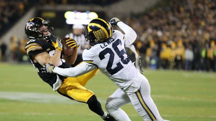 Nov 12, 2016; Iowa City, IA, USA; Iowa Hawkeyes wide receiver Riley McCarron (83) catches a pass in front of Michigan Wolverines cornerback Jourdan Lewis (26) during the first half at Kinnick Stadium. Mandatory Credit: Reese Strickland-USA TODAY Sports