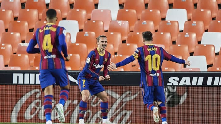 Antoine Griezmann of FC Barcelona celebrates with team mate Lionel Messi. (Photo by Aitor Alcalde Colomer/Getty Images)