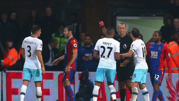 LONDON, ENGLAND - OCTOBER 15: Aaron Cresswell of West Ham United (3) is shown a red card and is sent off by referee Martin Atkinson during the Premier League match between Crystal Palace and West Ham United at Selhurst Park on October 15, 2016 in London, England. (Photo by Charlie Crowhurst/Getty Images)