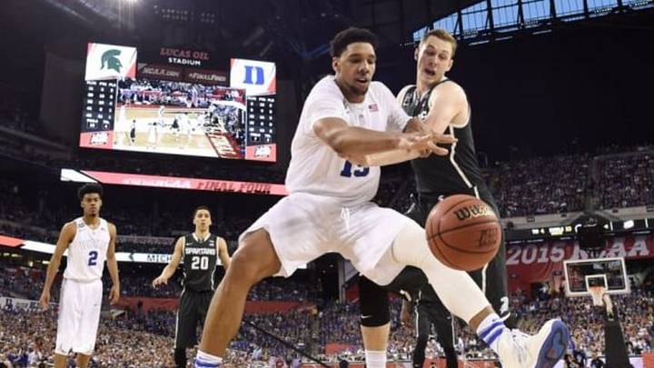 Apr 4, 2015; Indianapolis, IN, USA; Duke Blue Devils center Jahlil Okafor (15) battles for a loose ball with Michigan State Spartans forward Colby Wollenman (41) in the second half of the 2015 NCAA Men Apr 4, 2015; Indianapolis, IN, USA; Duke Blue Devils center Jahlil Okafor (15) battles for a loose ball with Michigan State Spartans forward Colby Wollenman (41) in the second half of the 2015 NCAA Men