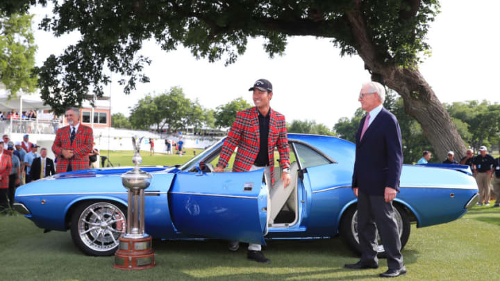 FORT WORTH, TEXAS - MAY 26: Kevin Na of the United States talks with Charles Schwab after being presented with a fully restored 1973 Dodge Challenger for winning the 2019 Charles Schwab Challenge at Colonial Country Club on May 26, 2019 in Fort Worth, Texas. (Photo by Tom Pennington/Getty Images)