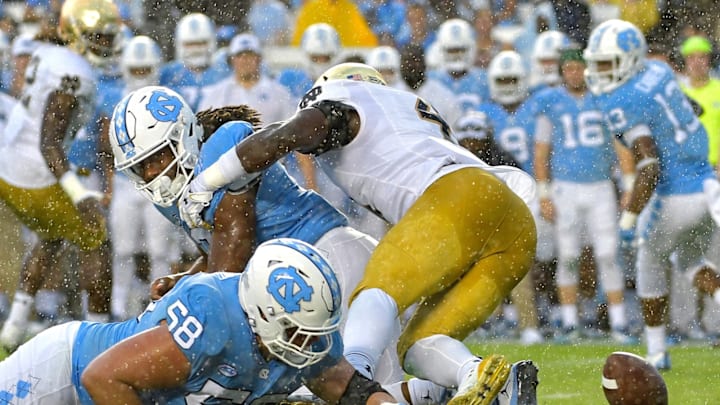 CHAPEL HILL, NC – OCTOBER 07: Nick Polino #58 of the North Carolina Tar Heels dives for a fumble forced by Te’von Coney #4 of the Notre Dame Fighting Irish during the game at Kenan Stadium on October 7, 2017 in Chapel Hill, North Carolina. (Photo by Grant Halverson/Getty Images)