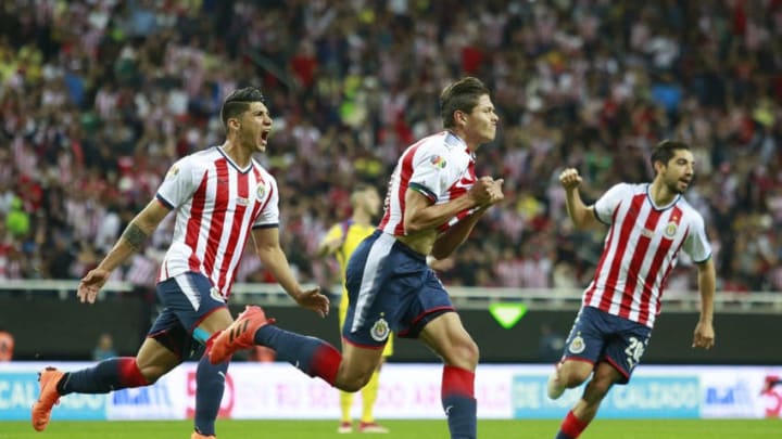 ZAPOPAN, MEXICO - MARCH 03: Jesus Godinez (C) of Chivas celebrates after scoring the first goal of his team during the 10th round match between Chivas and America as part of the Torneo Clausura 2018 Liga MX at Akron Stadium on March 03, 2018 in Zapopan, Mexico. (Photo by Juan Mejia/Jam Media/Getty Images)