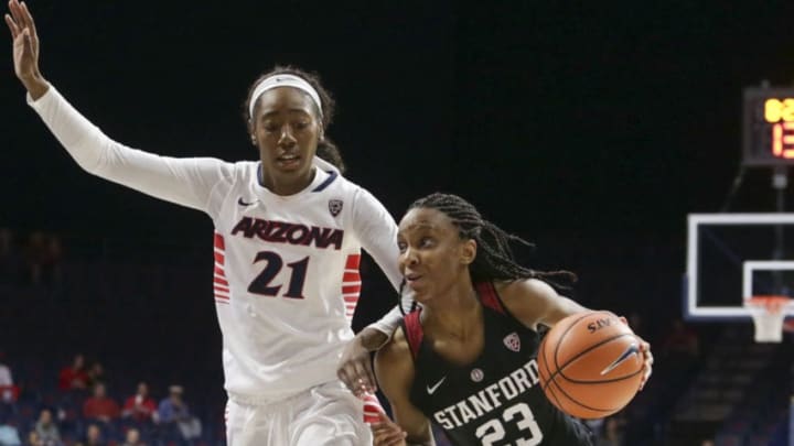 TUCSON, AZ - JANUARY 05: Stanford Cardinal guard Kiana Williams (23) dribbles the ball while Arizona Wildcats forward Destiny Graham (21) guards her during the a college women's basketball game between Stanford Cardinal and Arizona Wildcats on January 05, 2018, at McKale Center in Tucson, AZ. Stanford Cardinal defeats Arizona Wildcats 61-46. (Photo by Jacob Snow/Icon Sportswire via Getty Images)