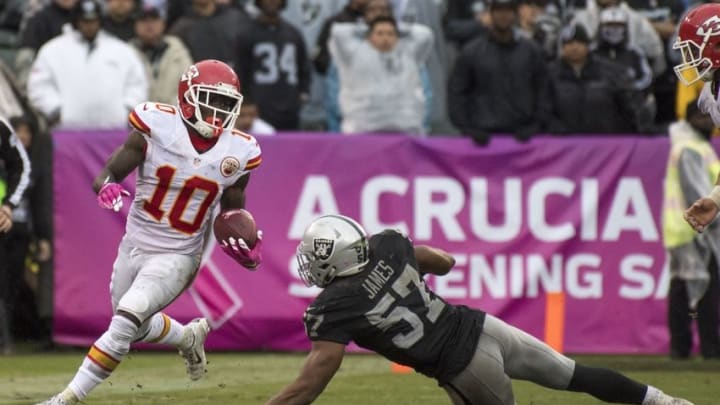 October 16, 2016; Oakland, CA, USA; Kansas City Chiefs wide receiver Tyreek Hill (10) runs past Oakland Raiders middle linebacker Cory James (57) during the third quarter at Oakland Coliseum. The Chiefs defeated the Raiders 26-10. Mandatory Credit: Kyle Terada-USA TODAY Sports