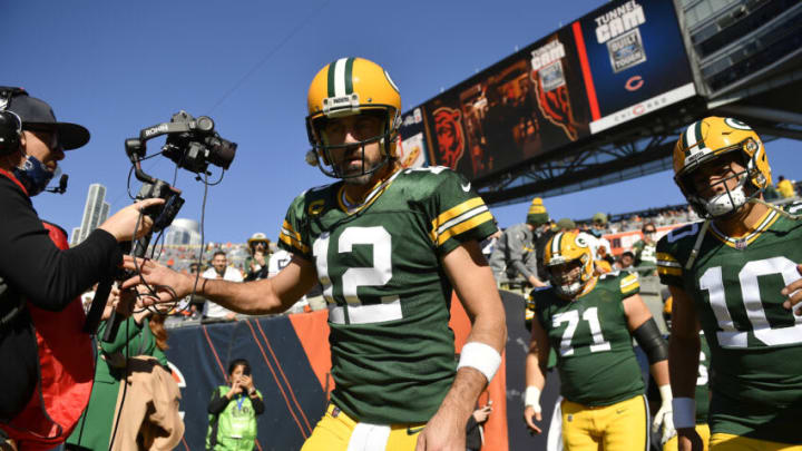 CHICAGO, ILLINOIS - OCTOBER 17: Aaron Rodgers #12 and Jordan Love #10 of the Green Bay Packers take the field before a game against the Chicago Bears at Soldier Field on October 17, 2021 in Chicago, Illinois. (Photo by Quinn Harris/Getty Images)