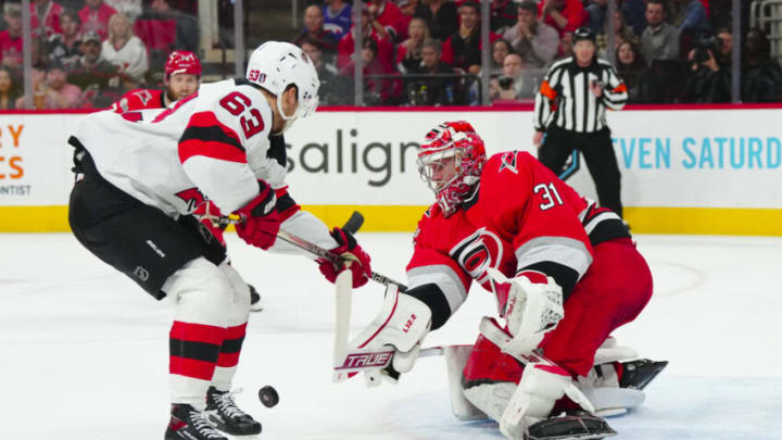 May 11, 2023; Raleigh, North Carolina, USA; Carolina Hurricanes goaltender Frederik Andersen (31) misplays the puck against New Jersey Devils left wing Jesper Bratt (63) during the second period in game five of the second round of the 2023 Stanley Cup Playoffs at PNC Arena. Mandatory Credit: James Guillory-USA TODAY Sports