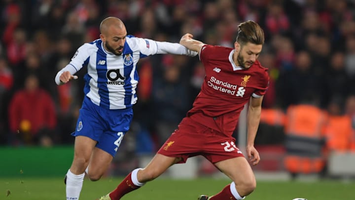 LIVERPOOL, ENGLAND - MARCH 06: Adam Lallana of Liverpool is fouled by Andre Andre of FC Porto during the UEFA Champions League Round of 16 Second Leg match between Liverpool and FC Porto at Anfield on March 6, 2018 in Liverpool, United Kingdom. (Photo by Shaun Botterill/Getty Images)
