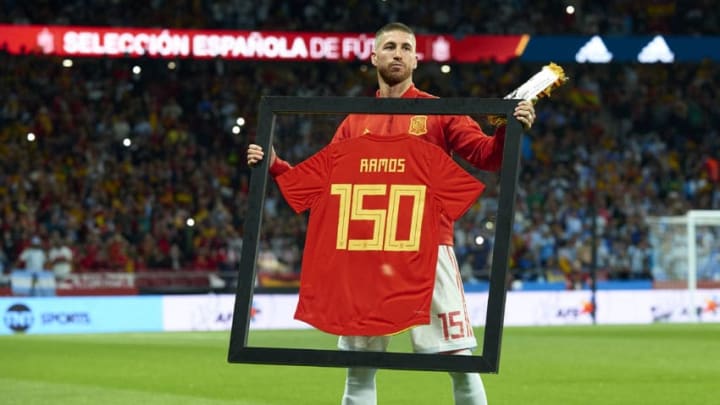 MADRID, SPAIN - MARCH 27: Sergio Ramos of Spain poses with a special framed jersey marking his 150th cap for Spain prior to the international friendly match between Spain and Argentina at Wanda Metropolitano stadium on March 27, 2018 in Madrid, Spain. (Photo by Quality Sport Images/Getty Images)