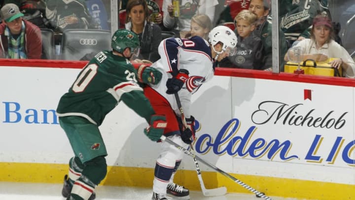 ST. PAUL, MN - OCTOBER 14: Alexander Wennberg #10 of the Columbus Blue Jackets controls the puck with Ryan Suter #20 of the Minnesota Wild defending during the game at the Xcel Energy Center on October 14, 2017 in St. Paul, Minnesota. (Photo by Bruce Kluckhohn/NHLI via Getty Images)