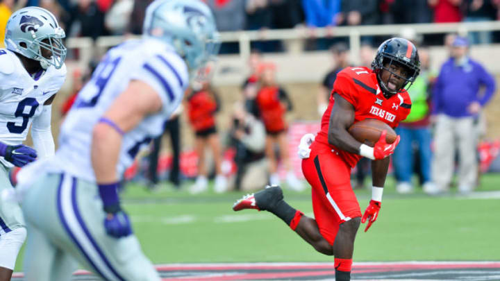 LUBBOCK, TX - NOVEMBER 14: Jakeem Grant #11 of the Texas Tech Red Raiders gets yards after making a catch against the Kansas State Wildcats on November 14, 2015 at Jones AT&T Stadium in Lubbock, Texas. Texas Tech won the game 59-44. (Photo by John Weast/Getty Images)