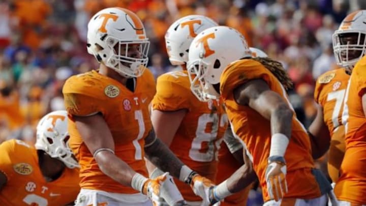 Jan 1, 2016; Tampa, FL, USA;Tennessee Volunteers running back Jalen Hurd (1) is congratulated by teammates as he scores a touchdown against the Northwestern Wildcats during the second half in the 2016 Outback Bowl at Raymond James Stadium. Mandatory Credit: Kim Klement-USA TODAY Sports