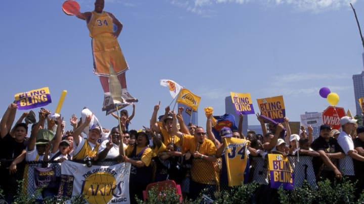 21 Jun 2000: A view of fans as they hold up a Shaquille O''Neal sign in front of the Staples Center during the Laker's Victory Parade in Los Angeles, California. NOTE TO USER: It is expressly understood that the only rights Allsport are offering to license in this Photograph are one-time, non-exclusive editorial rights. No advertising or commercial uses of any kind may be made of Allsport photos. User acknowledges that it is aware that Allsport is an editorial sports agency and that NO RELEASES OF ANY TYPE ARE OBTAINED from the subjects contained in the photographs.Mandatory Credit: Ezra O. Shaw /Allsport