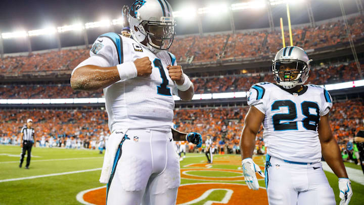 Sep 8, 2016; Denver, CO, USA; Carolina Panthers quarterback Cam Newton (1) does his Superman pose as he celebrates his second quarter touchdown with running back Jonathan Stewart (28) against the Denver Broncos at Sports Authority Field at Mile High. Mandatory Credit: Mark J. Rebilas-USA TODAY Sports