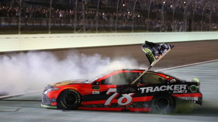 HOMESTEAD, FL - NOVEMBER 19: Martin Truex Jr., driver of the #78 Bass Pro Shops/Tracker Boats Toyota, celebrates with a burnout after winning the Monster Energy NASCAR Cup Series Championship and the Monster Energy NASCAR Cup Series Championship Ford EcoBoost 400 at Homestead-Miami Speedway on November 19, 2017 in Homestead, Florida. (Photo by Chris Graythen/Getty Images)
