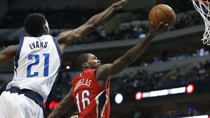Nov 7, 2015; Dallas, TX, USA; New Orleans Pelicans guard Toney Douglas (16) shoots the ball past Dallas Mavericks forward Jeremy Evans (21) in the fourth quarter at American Airlines Center. The Mavericks won 107-98. Mandatory Credit: Tim Heitman-USA TODAY Sports